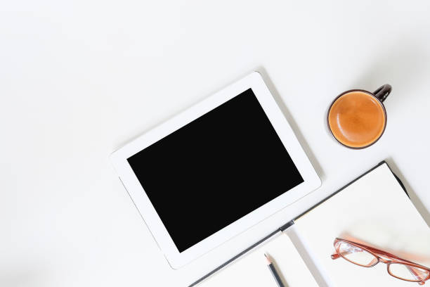 istock Copy space with tablet digital, coffee, notebook and glasses on workspace top view. 1023438716