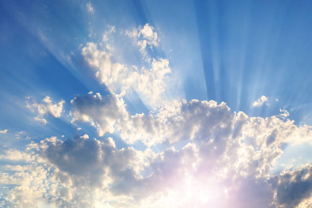 istock Sky with gray and blue clouds and red-orange highlight from the Sun 1023444996