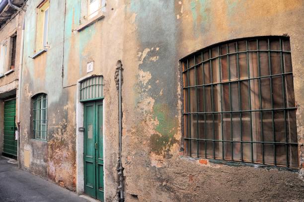 istock Old and damaged uninhabited building facade. 1023450740