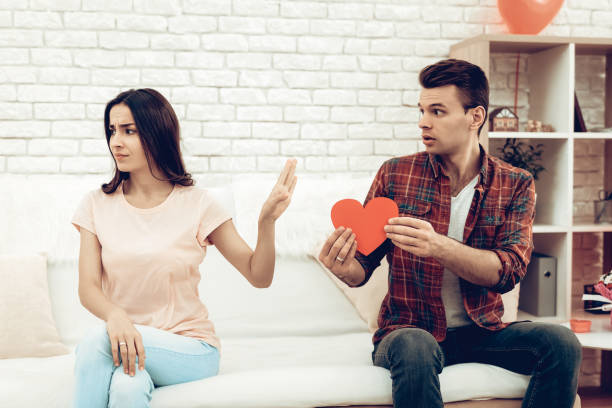 the girl refuses boyfriend on valentine's day. - pleading men women reconciliation imagens e fotografias de stock