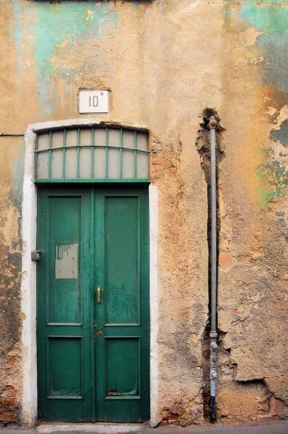 istock Old and damaged uninhabited building facade. 1023451380
