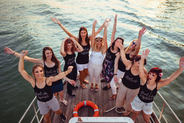 ladies celebrating bachelorette party - bride wedding freedom arms raised imagens e fotografias de stock