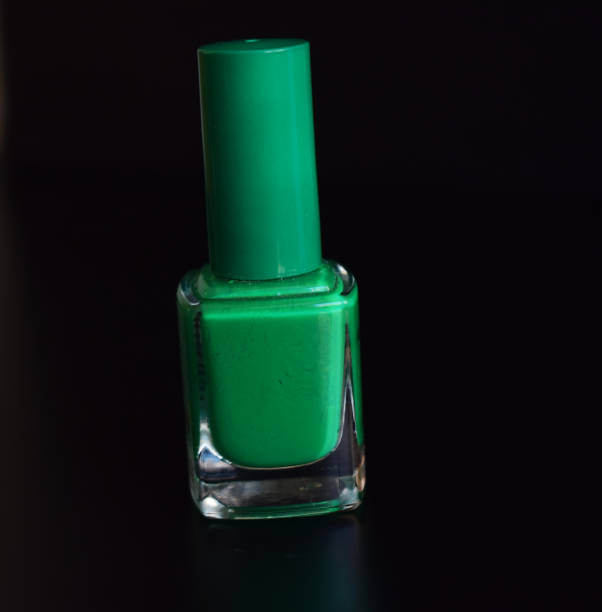 istock Green nail painting with glitter. 1023461718