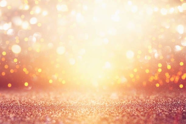 istock glitter vintage lights background. silver and gold. de-focused. 1023465578