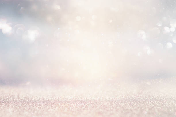 istock glitter vintage lights background. silver and light gold. de-focused. 1023467772