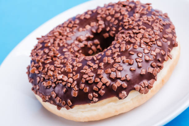 istock Donut. Sweet icing sugar food. 1023468438
