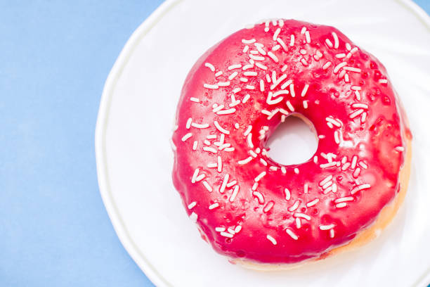 istock Donut. Sweet icing sugar food. 1023468610
