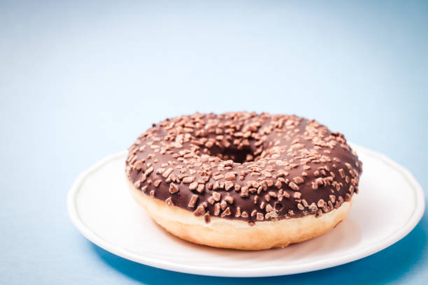 istock Donut. Sweet icing sugar food. 1023468614