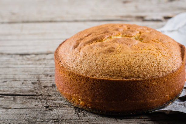 istock lassical sponge cake on wooden table background 1023471770