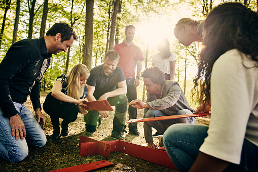 Cropped shot of a group of diverse colleagues team building at a company retreat