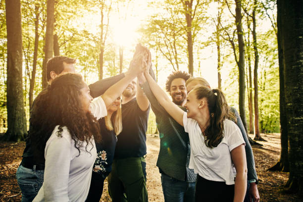 Stronger together Cropped shot of a group of diverse colleagues team building at a company retreat team event stock pictures, royalty-free photos & images