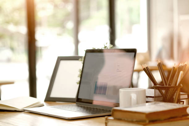 istock Workplace with laptop and vintage books on desk. 1023480286