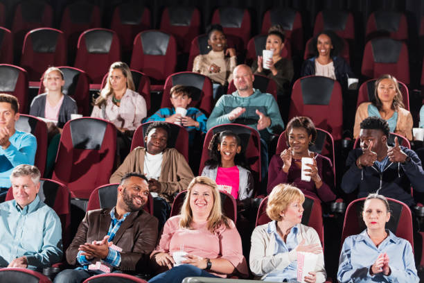 istock Multi-ethnic audience in movie theater 1023480956