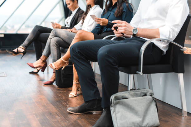 istock Group of people sitting in line and waiting for an interview 1023481740