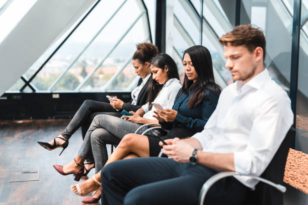 istock Group of people sitting in line and waiting for an interview 1023481900