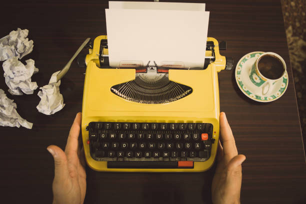 istock A man with no inspiration in front of the typewriter. 1023485988