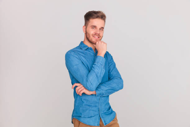 istock portrait of casual man smiling and thinking 1023486202