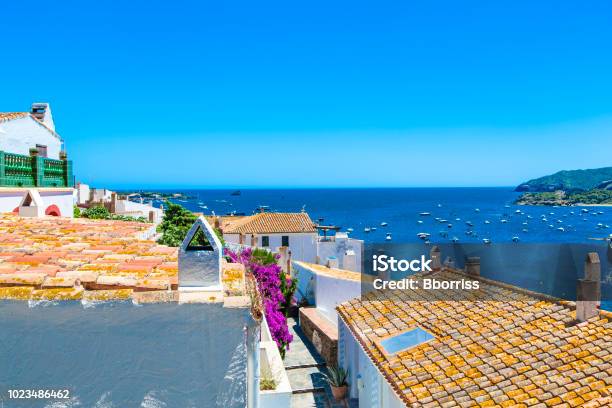 View On Street In Cadaques Catalonia Spain Near Of Barcelona Scenic Old Town With Nice Beach And Clear Blue Water In Bay Famous Tourist Destination In Costa Brava With Salvador Dali Landmark Stock Photo - Download Image Now