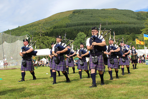 Crieff, Scotland, 21 July 2018: The Badenoch & Strathspey Pipe Band perform at the Lochearnhead highland Games near Crieff in Scotland. They are a grade 4B Pipe band based in the Highlands.