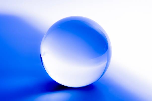 istock Glass ball in abstract blue light 1023486854