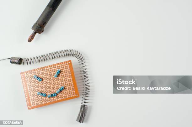 Emoji Face On A Blank Circuit Board Stock Photo - Download Image Now - Accuracy, Art, Artificial