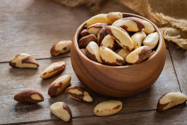 istock Brazil nuts in wooden bowl 1023489780