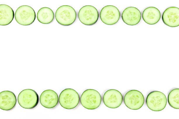 istock Cucumber slices forming a frame on a white background with copyspace 1023496062