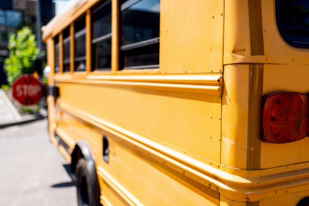 istock partial view of traditional school bus with stop sign 1023496320