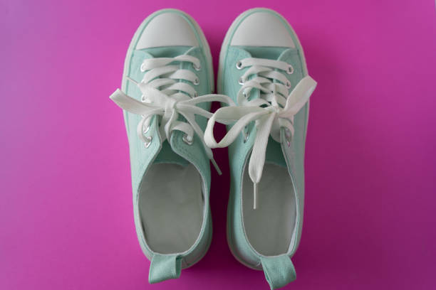 istock Sneakers on Purple 1 1023505328