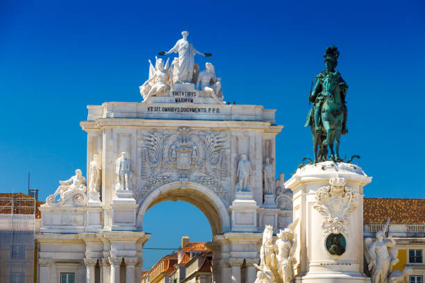 Triumphal arch (1873) and statue in Commerce Square in the city of Lisbon stock photo