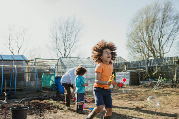 istock Playing with Bubbles at Grandad's Allotment 1023514230