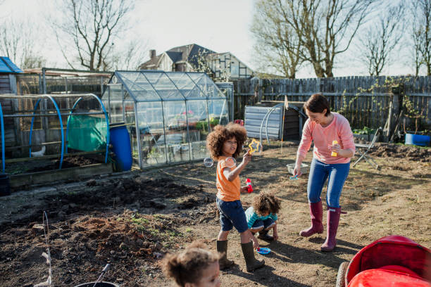 istock Blowing Bubbles at the Allotment 1023514286
