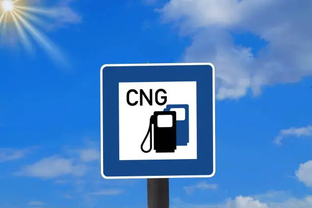 A traffic sign and reference to a filling station with CNG natural gas