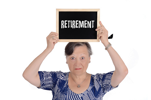 Elderly woman holding chalkboard with text \