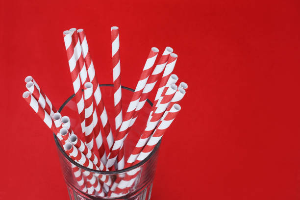 istock Red drinking straws in a glass 1023517068