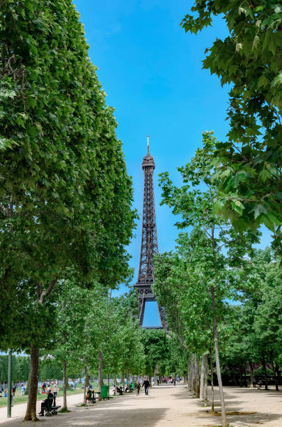 istock People during spring recreation in Paris park Champ de Mars with iconic Eiffel tower at background 1023518680