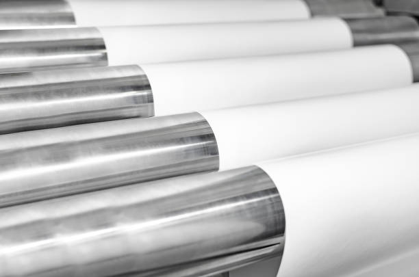 istock Offset printing press at work with layers of roll paper running on roller 1023523314