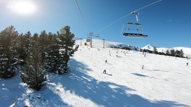 POV point of view. Open air ski lifts in Bansko, Bulgaria stock photo
