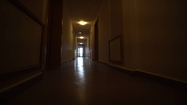 istock POV walk through hotel corridor, low angle POV 1023528874