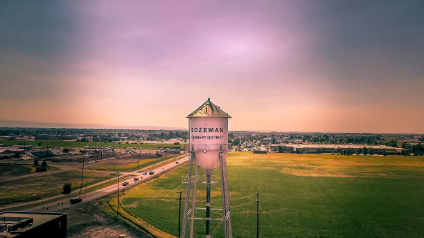 Cannery Row District Bozeman Montana Aerial view of the new district in Bozeman Montana, Cannery Row. Water tower, field and new buildings at sunset with a dramatic sky. montana western usa photos stock pictures, royalty-free photos & images