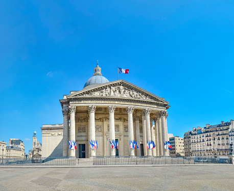 Low-angle view of Arc de Triomphe on The Place Charles de Gaulle in Paris, France.