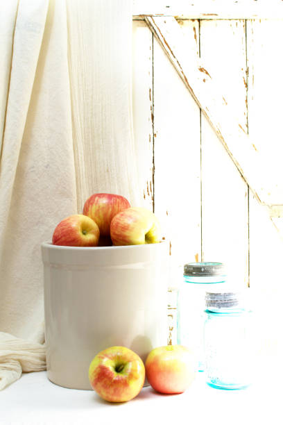istock Apples, Glazed Crockery and Canning Jars Rustic Clean Background Backdrop for Autumn 1023543476