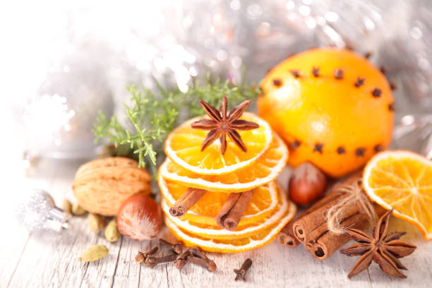 dry orange slice with cinnamon, christmas spices background