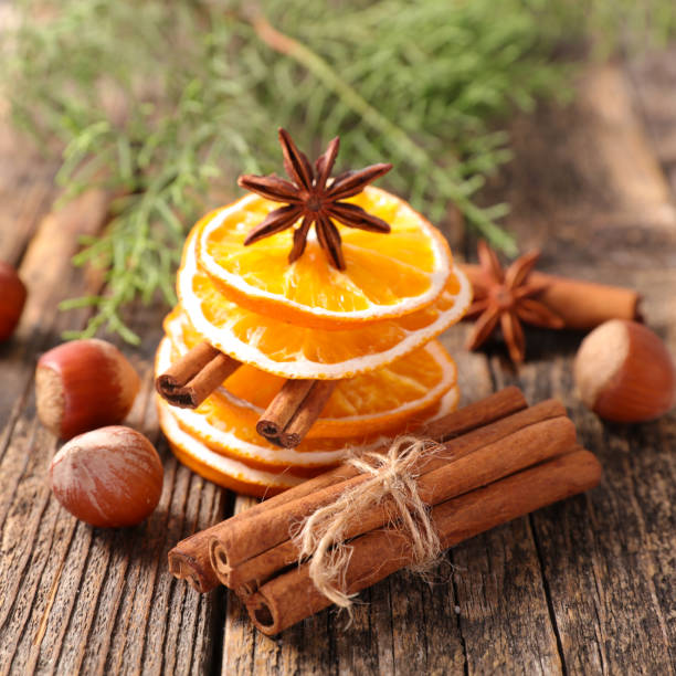 istock dry orange slice with cinnamon, christmas spices background 1023545688