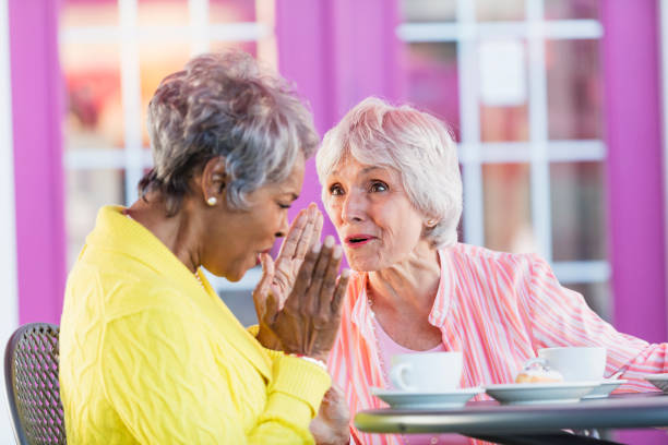 istock Two multi-ethnic senior women talking over coffee 1023546636