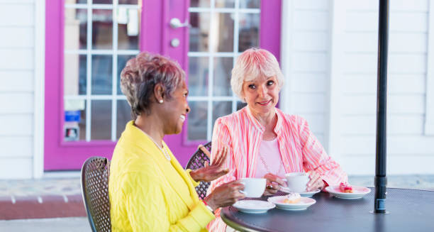 istock Two multi-ethnic senior women talking over coffee 1023546638