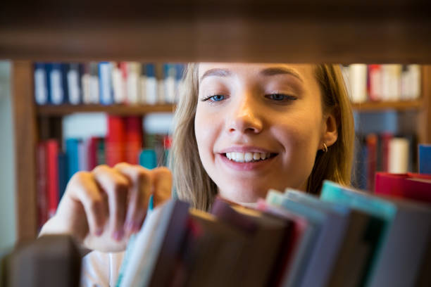 Student in library stock photo