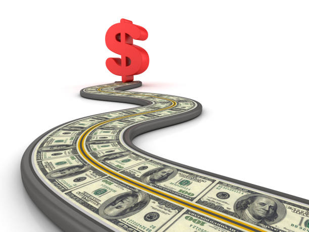 istock Winding 3D Road with Dollar Sign and Bills - 3D Rendering 1023548846