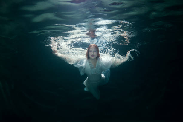 istock Beautiful woman under the water. 1023551226
