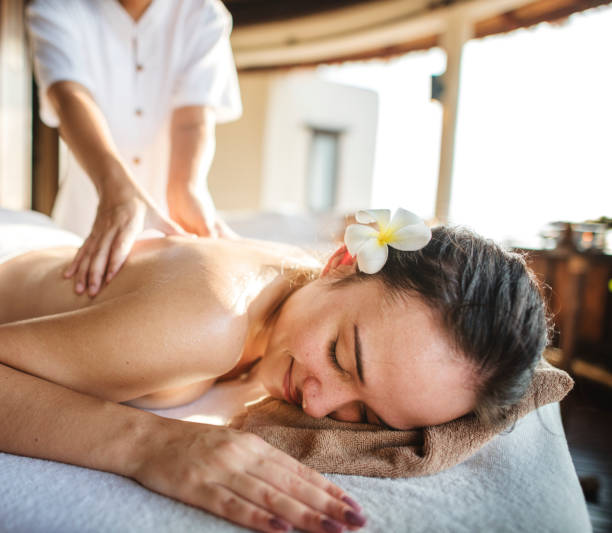 istock Woman relaxing with a herbal massage 1023552802